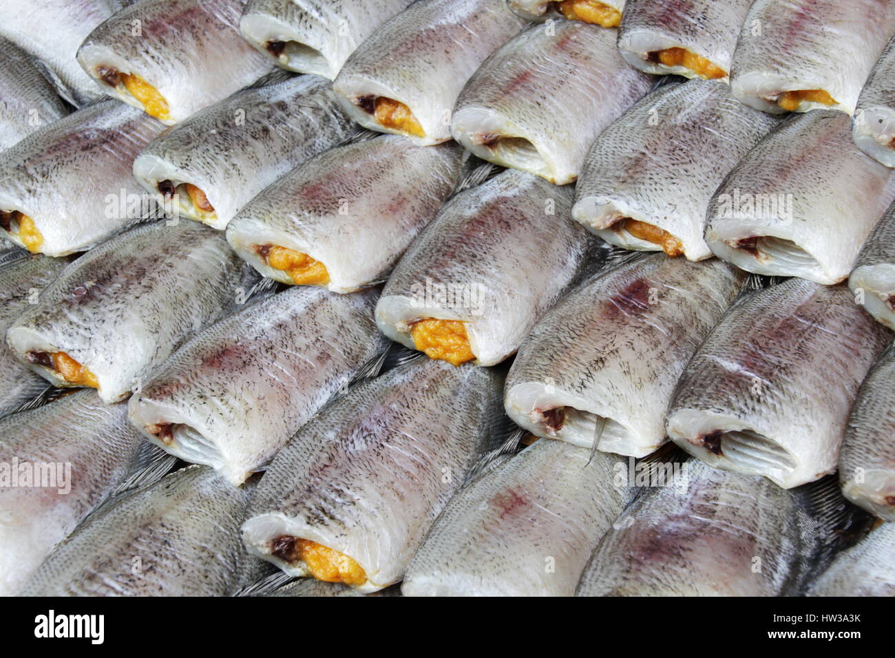 Thai Dried Salted Fish Making - Snakeskin gourami in the Food Market in Thailand Stock Photo
