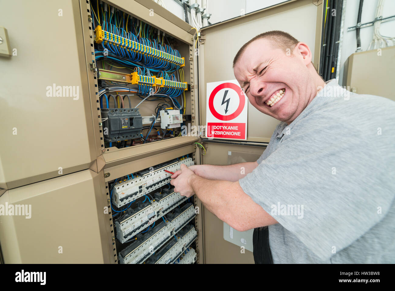 electrician electrocuted. grimace of pain on his face Stock Photo