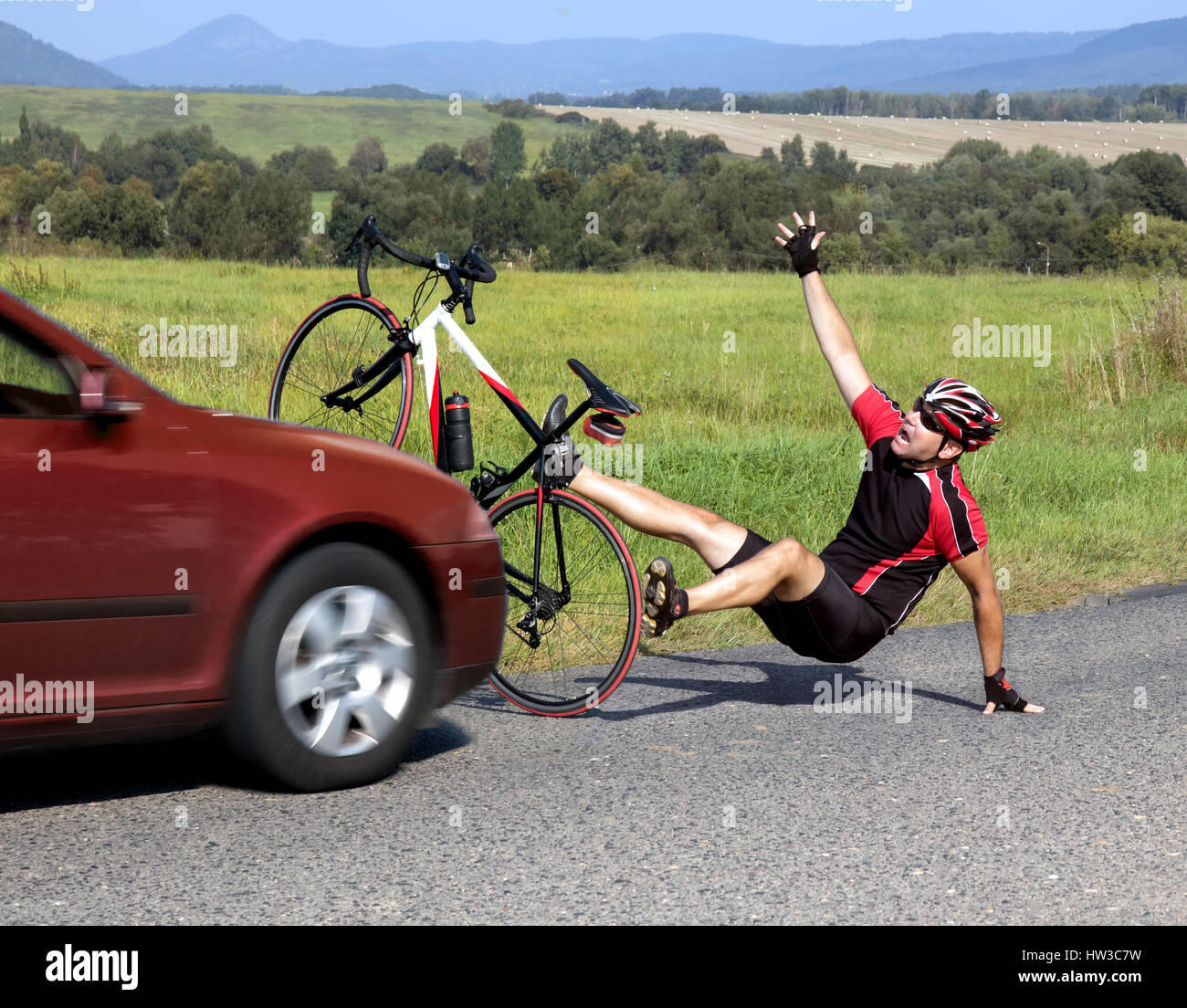 Accident cars with biker. Car collides cyclist on the road. Dangerous traffic on asphalt way on the countryside. Road crash misfortune car with a cycl Stock Photo