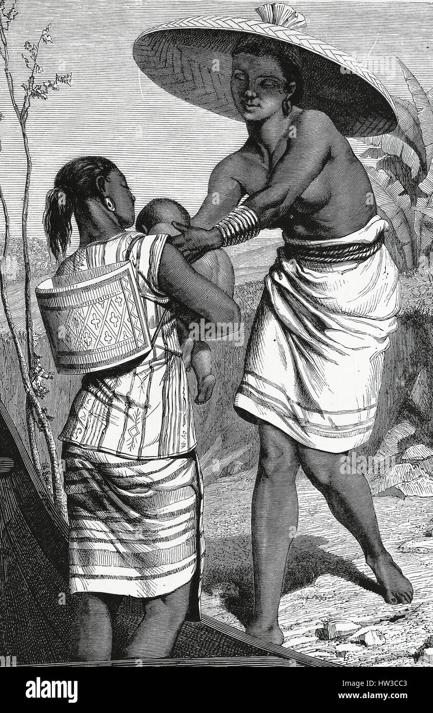 Dayak women taking care of a child circa 1860.  19th Century. Borneo. Engraving. Stock Photo