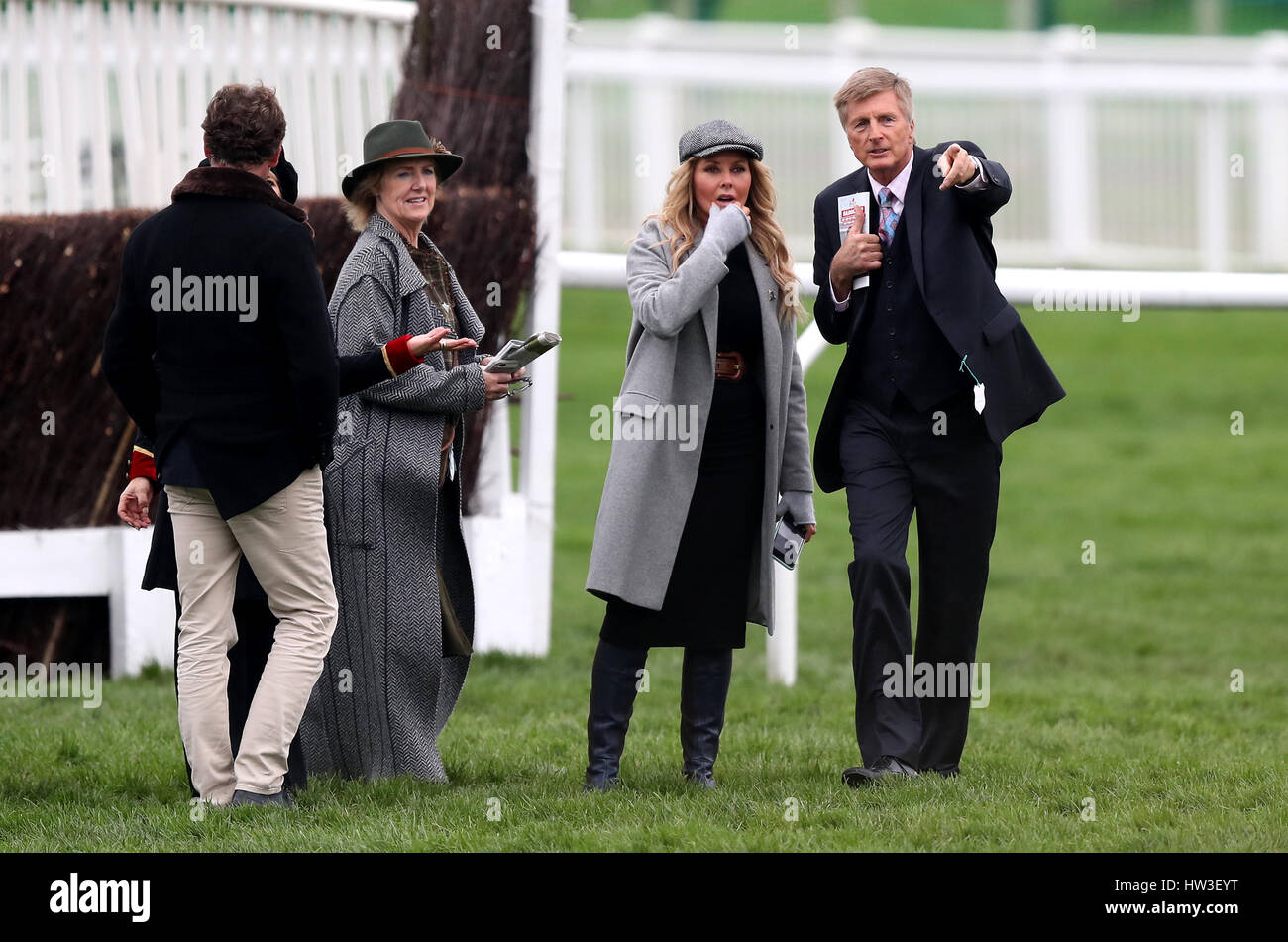 Carol Vorderman and trainer Michael Dickinson on the course during St