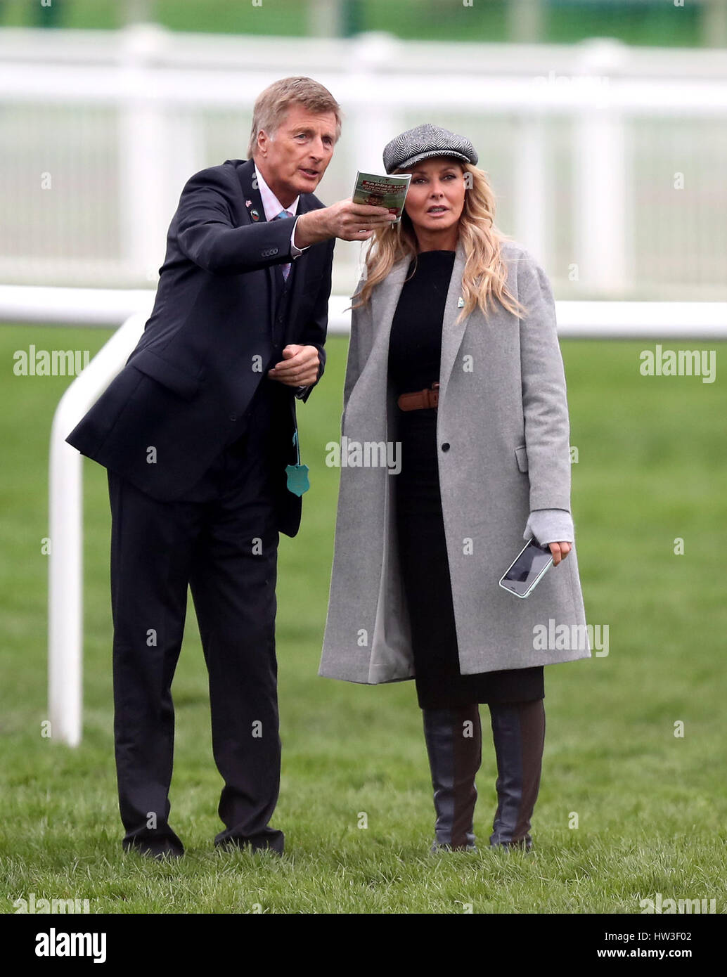Carol Vorderman and trainer Michael Dickinson on the course during St