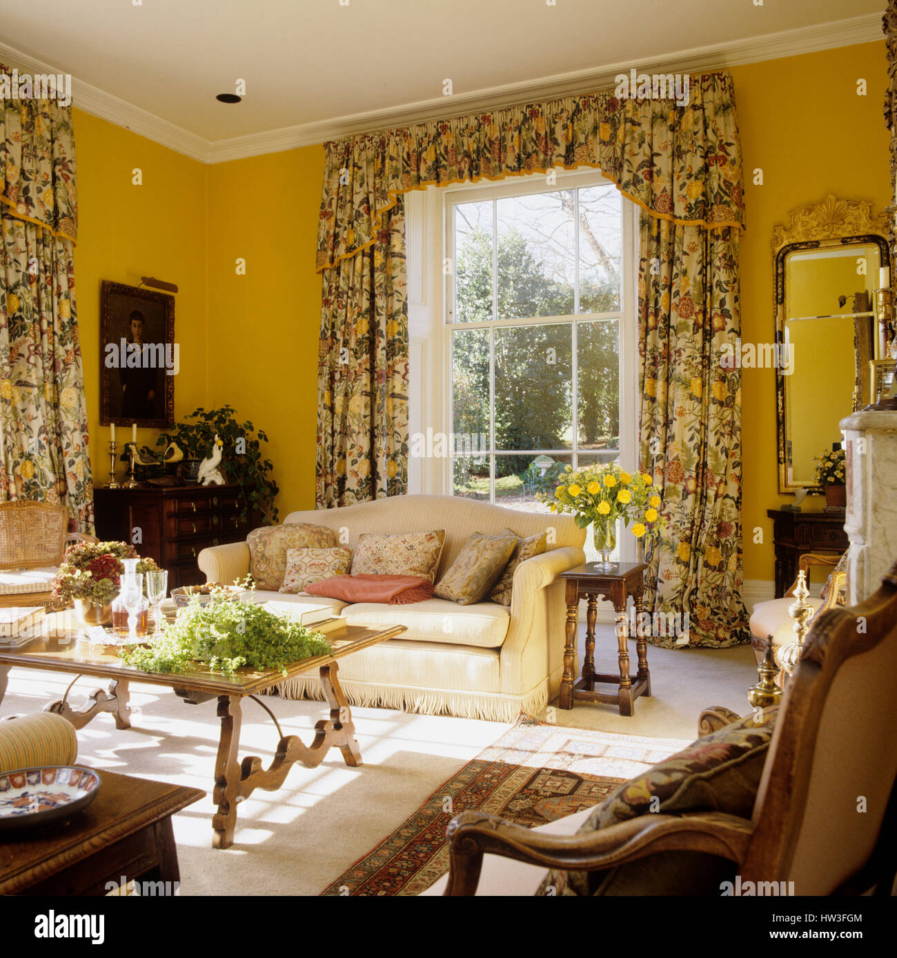 Living room with floral patterned curtains. Stock Photo