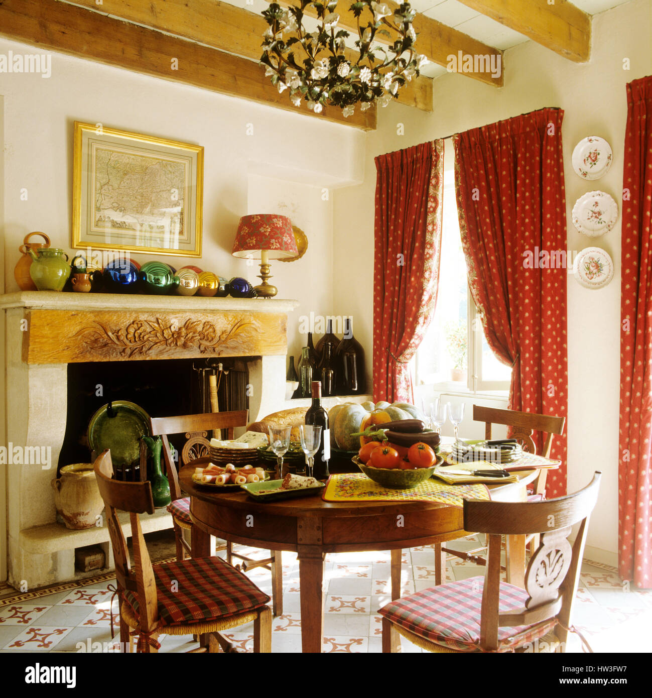 Dining table next to fireplace Stock Photo Alamy