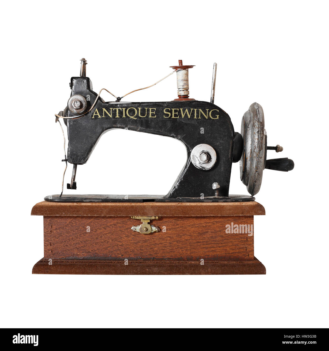 The image of the antique sewing machine isolated on a white background ...