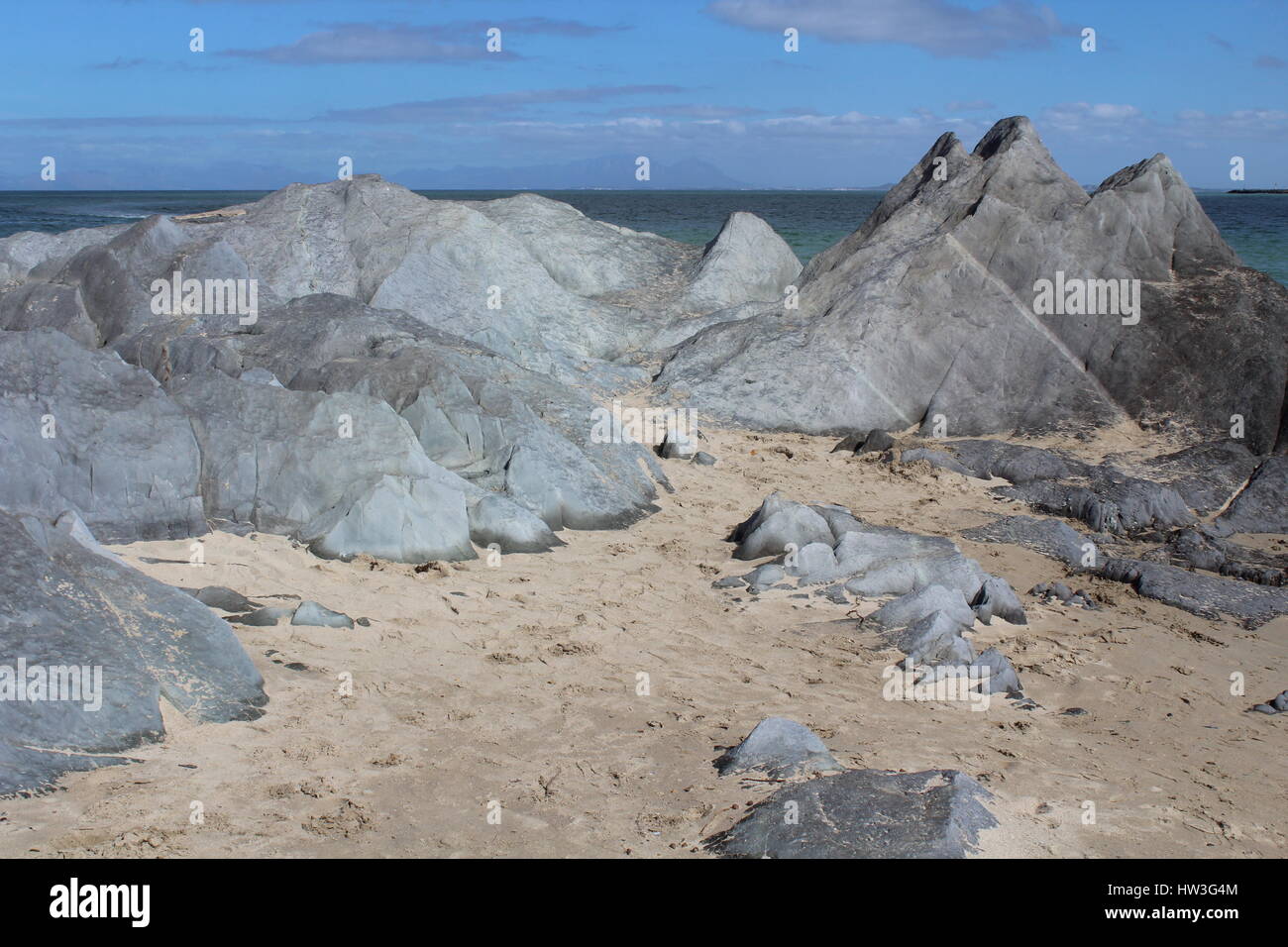 Rock formations at Gordons Bay beach, Western Cape, South Africa Stock Photo