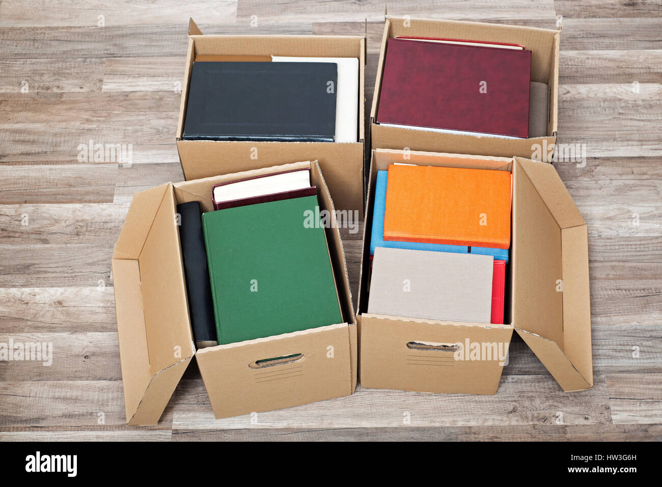 cardboard boxes full of books Stock Photo Alamy