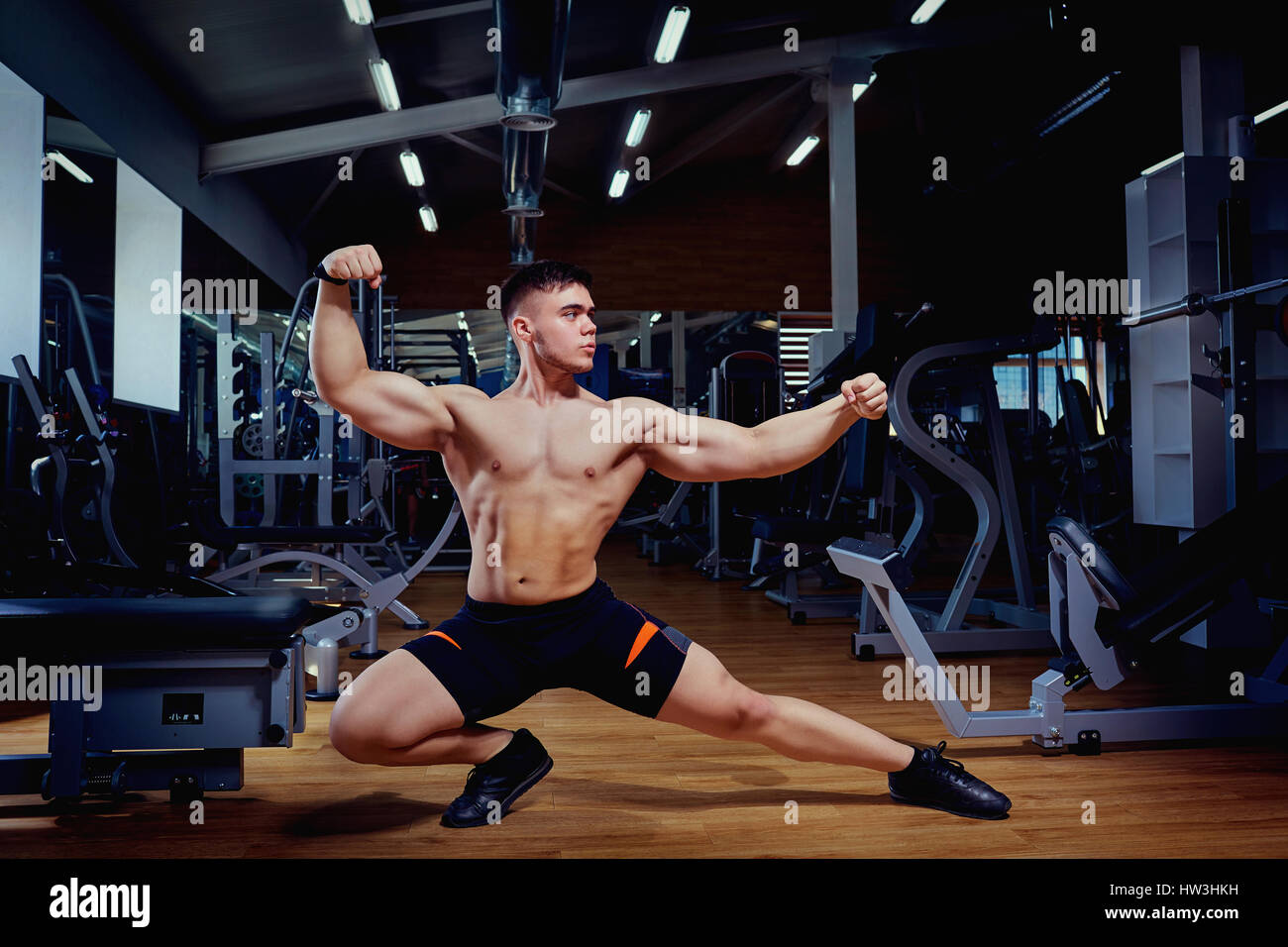 Muscular man posing in gym :: Stock Photography Agency :: Pixel-Shot Studio