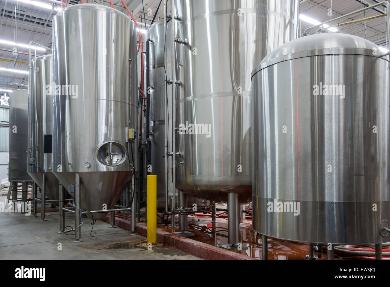 Large stainless steel containers at a beer brewery. Stock Photo