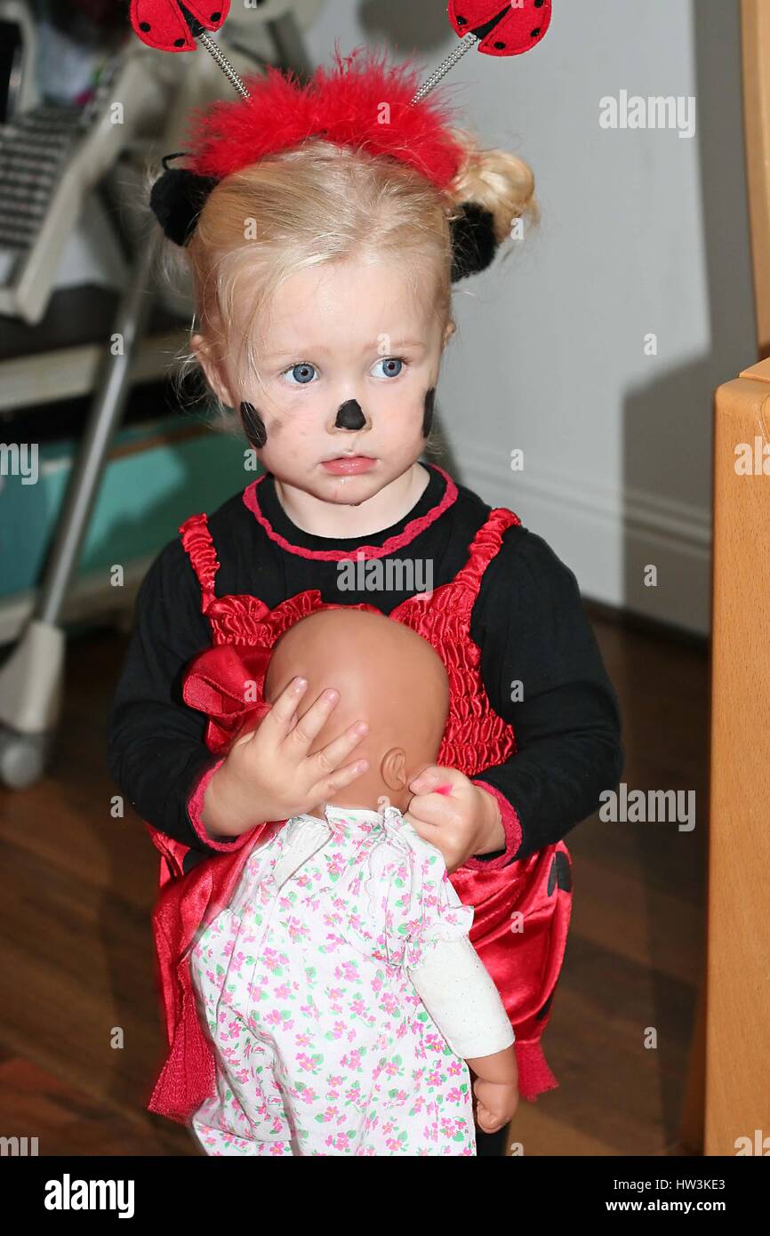 Baby ladybird ,child costume at Halloween, wear face paint, face painting  Stock Photo - Alamy