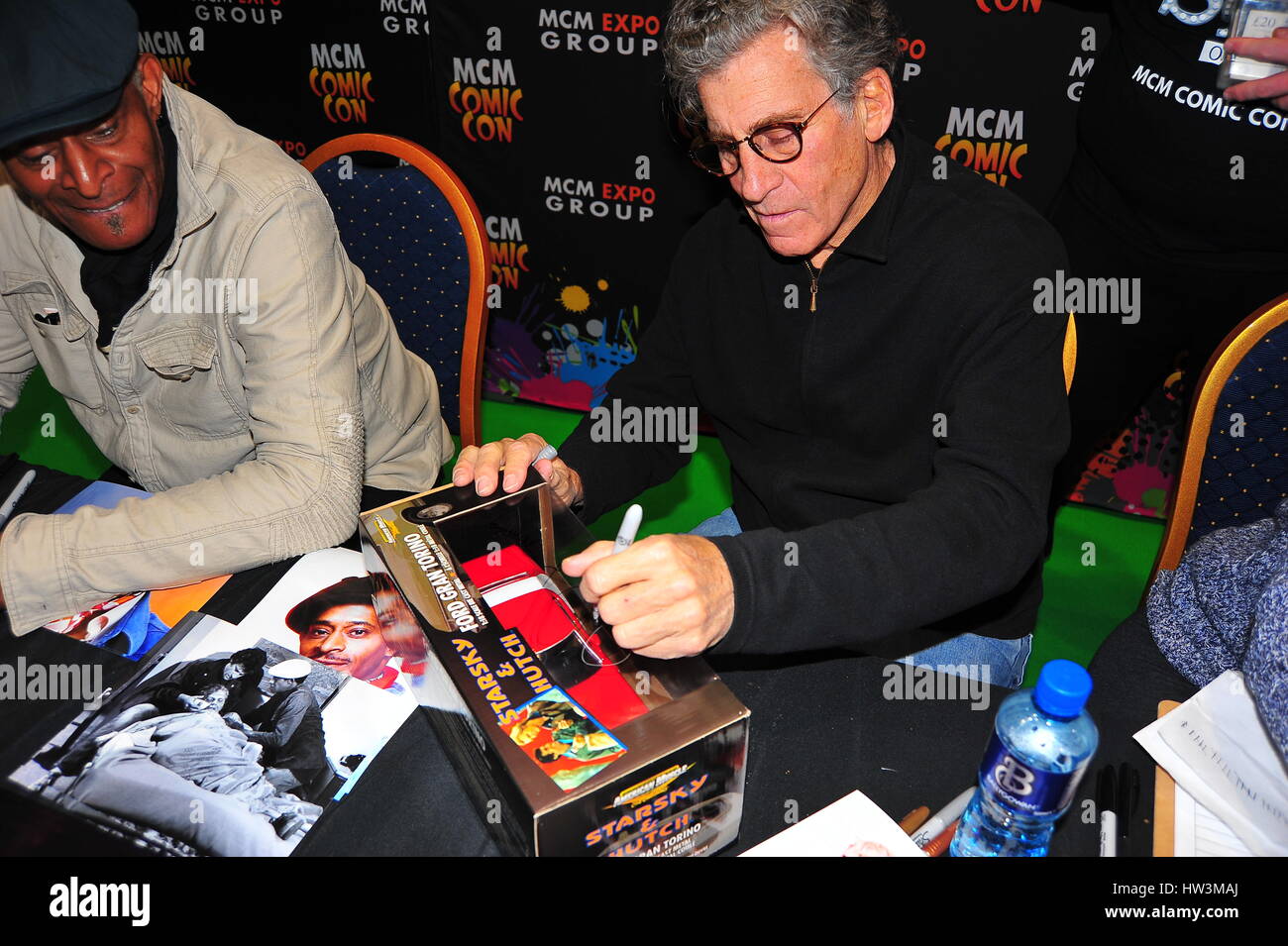 Starsky & Hutch stars Paul Michael Glaser & Antonio Fargas sign items for fans at the Liverpool MCM Comicon. Stock Photo
