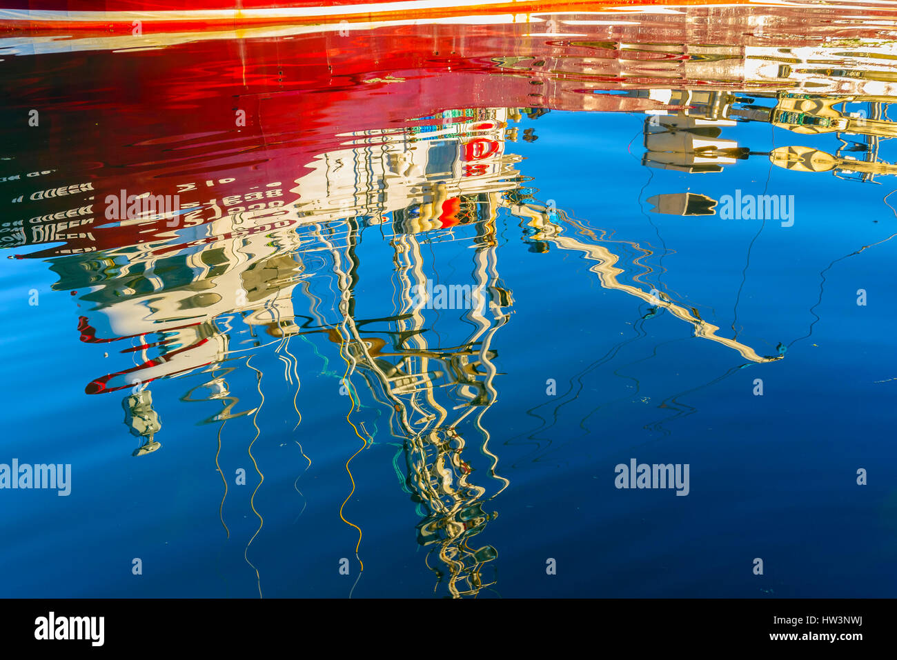 Fishing boat reflection, Ucluelet Harbour, Ucluelet, British Columbia, Canada Stock Photo