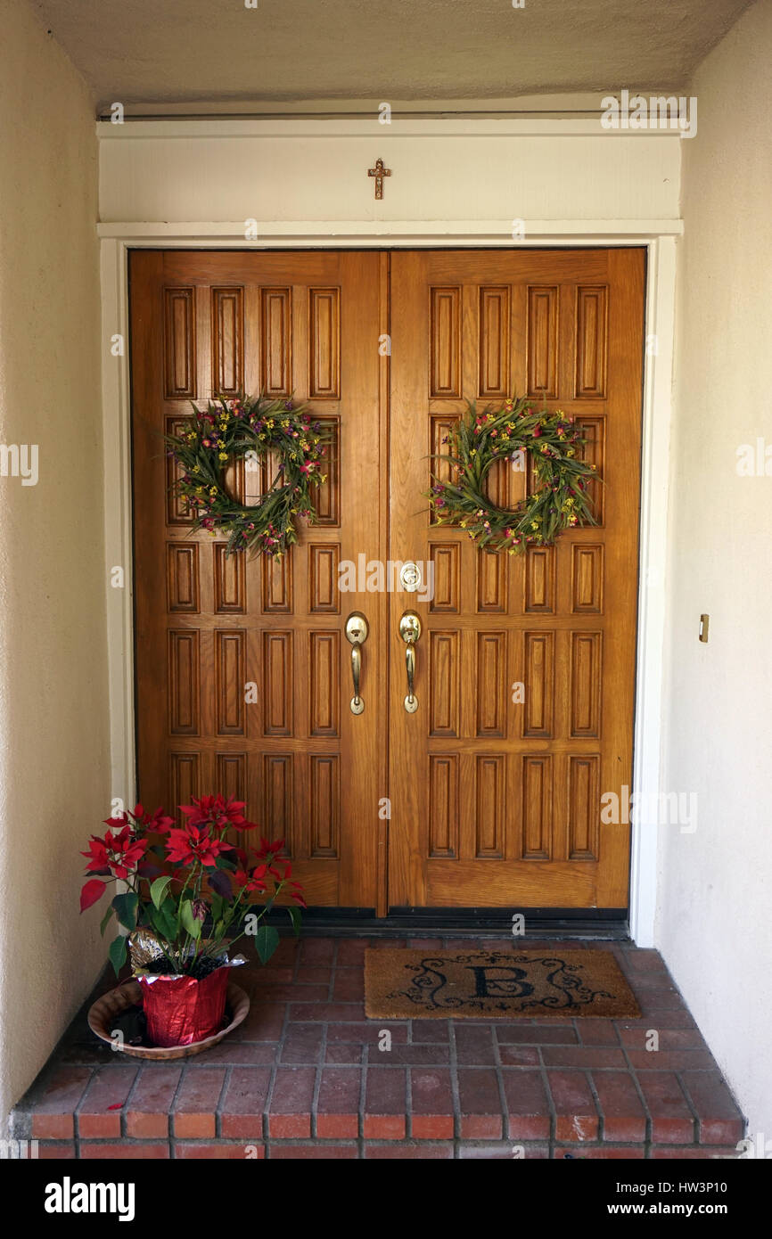 Oak double entrance doors with Spring wreaths Stock Photo Alamy