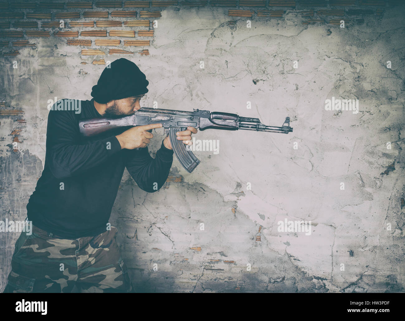 terrorist in black uniform and mask with kalashnikov ak47 Stock Photo