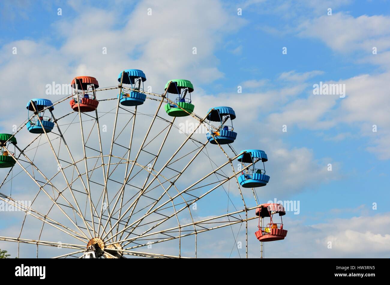 Ferris wheel in a summer amusement park Stock Photo - Alamy