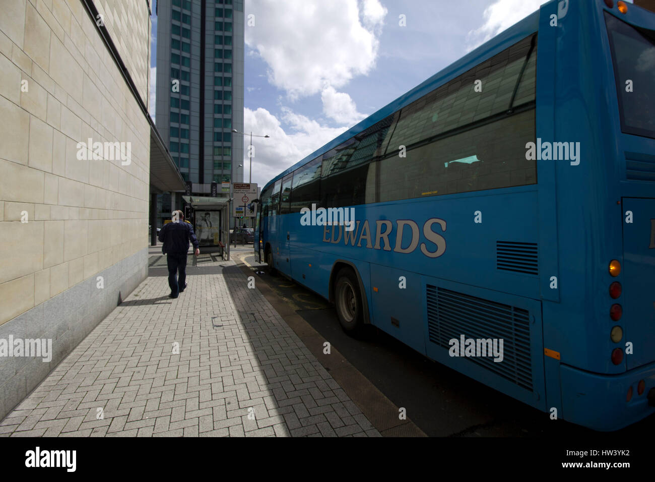 CARDIFF, UNITED KINGDOM. Edwards bus parked outside a bus stop with no queue. Stock Photo