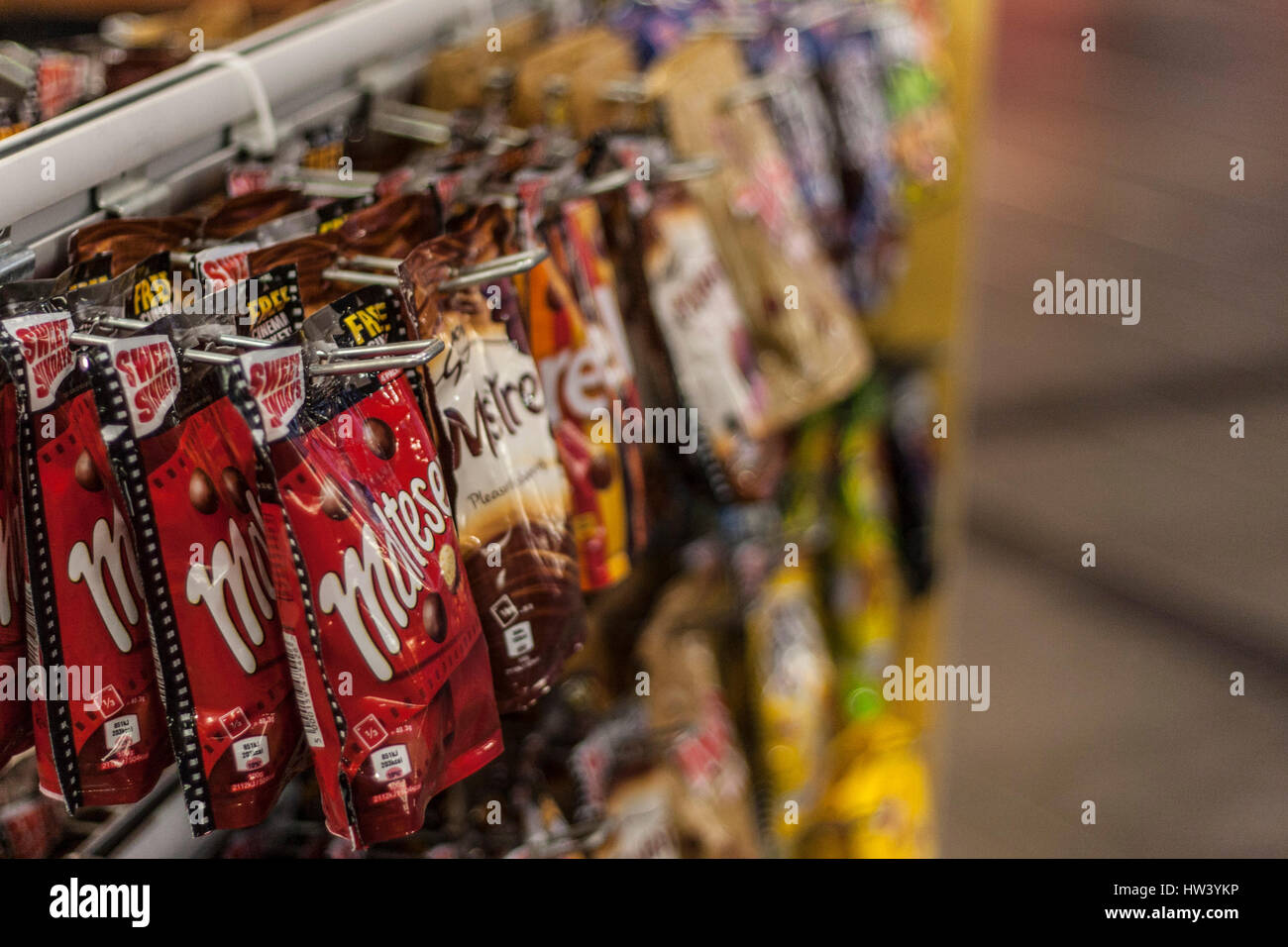 CARDIFF, UNITED KINGDOM. Bags of sweets and chocolates are sold as a cinema snack at Cineworld. Stock Photo