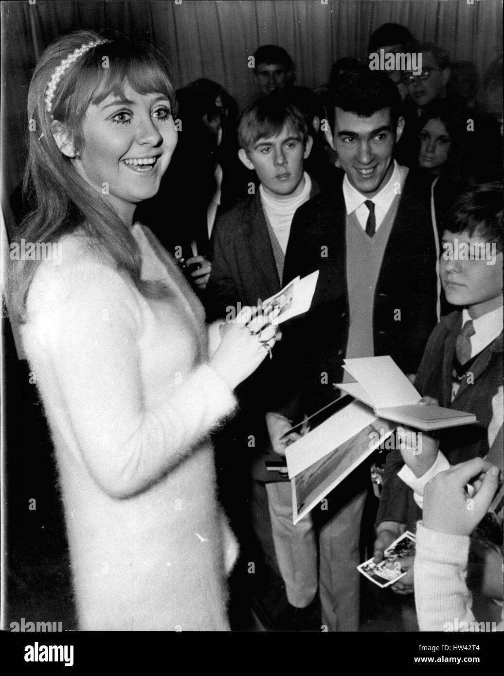 Dec. 12, 1968 - LULU - VOTED THE WORLD'S TOP FEMALE SINGER HOLDS A CHRISTMAS FOR 150 FANS LULU - who is to represent Britain in the Eurovision song contest - and recently voted the world's top female singer, today gave a Christmas party for 150 fans at Manchester Square, London W.L. PHOTO SHOWS: Lulu, the 20-year-old singer from Glaegow, signs autograph. for some of the fan. who attended today Christmas party, (Credit Image: © Keystone Press Agency/Keystone USA via ZUMAPRESS.com) Stock Photo
