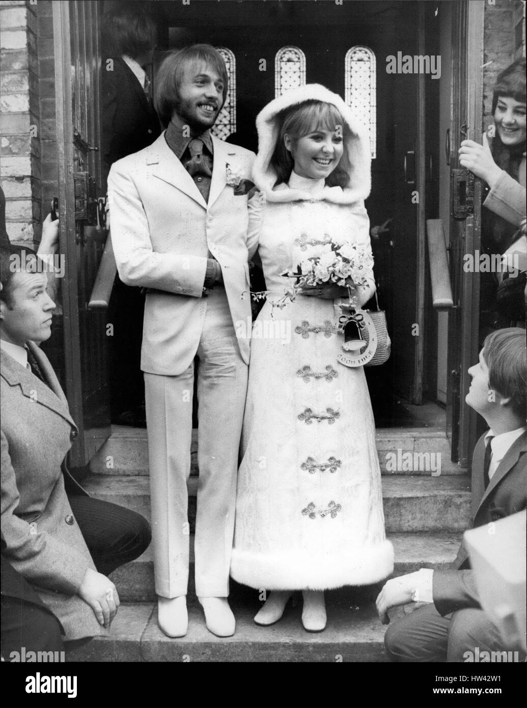 Feb. 02, 1969 - Lulu Weds: Pop Singer Lulu was married today to Maurice Gibb, of the Bee Gees pop group- at St. James's Church, Gerrard's Cross, Buckingham shire. Lulu wore a floor length coat and dress in white moire complete with attached hood. Hood and coat were trimmed with white mink- around the hood and down the front of the coat. Maurice was wearing a white suit with a royal blue moire shirt. Picture Shows: The bride and groom after the ceremony. (Credit Image: © Keystone Press Agency/Keystone USA via ZUMAPRESS.com) Stock Photo