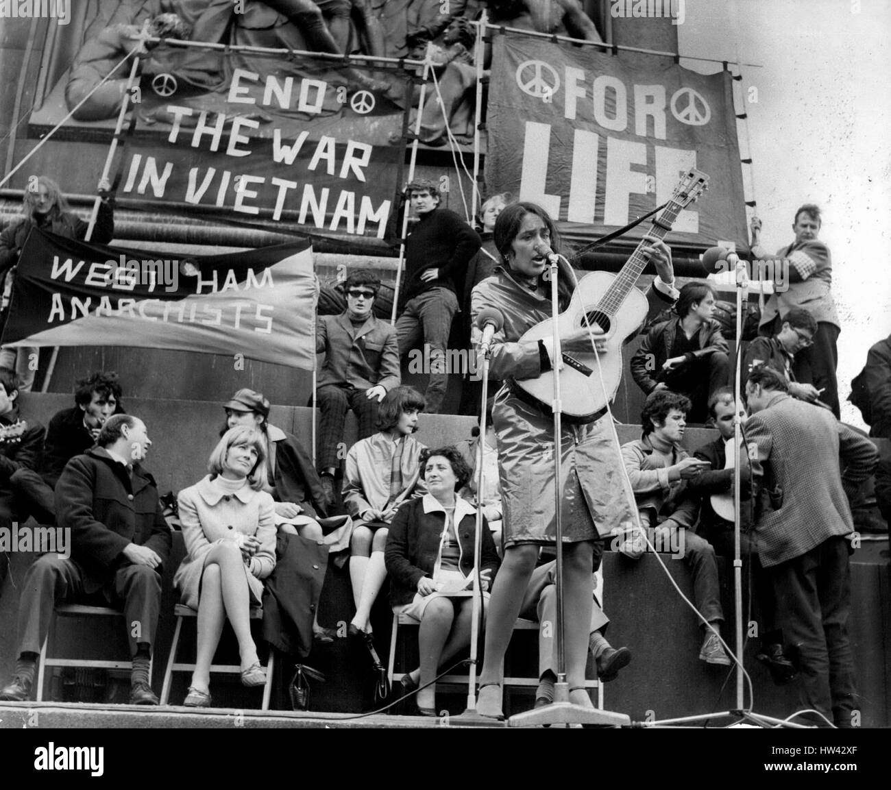 May 05, 1965 - Peace In Vietnam Meeting In Trafalgar Square: The American folk singer and freedom marcher Joan Bafz, lead a march to stop the War in Vietnam The March is Organised jointly by the Campaign for Nuclear Disbarment and committee of 100. They marched from Marble Arch to Trafalgar Sq. to hold the Rally, after which they will go to Downing St to give message to the Prime Minister Mr. Wilson. Photo Shows Joan Baez the American Folk Singer playing to the mass Rally in Trafalgar Sq this afternoon. (Credit Image: © Keystone Press Agency/Keystone USA via ZUMAPRESS.com) Stock Photo