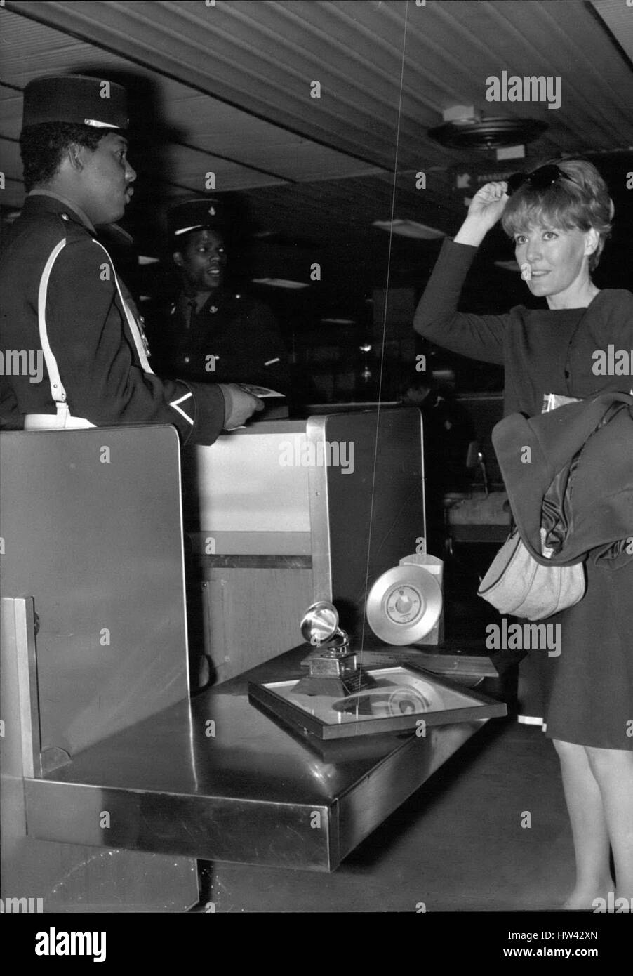May 19, 1965 - Petula Clark back from America:Petula Clark pictured at Orly Airport as she was displaying her Trophies received during her tour to two coloured customs officials at Orly Airfield this morning will she or will she not pay duty on them? (Credit Image: © Keystone Press Agency/Keystone USA via ZUMAPRESS.com) Stock Photo