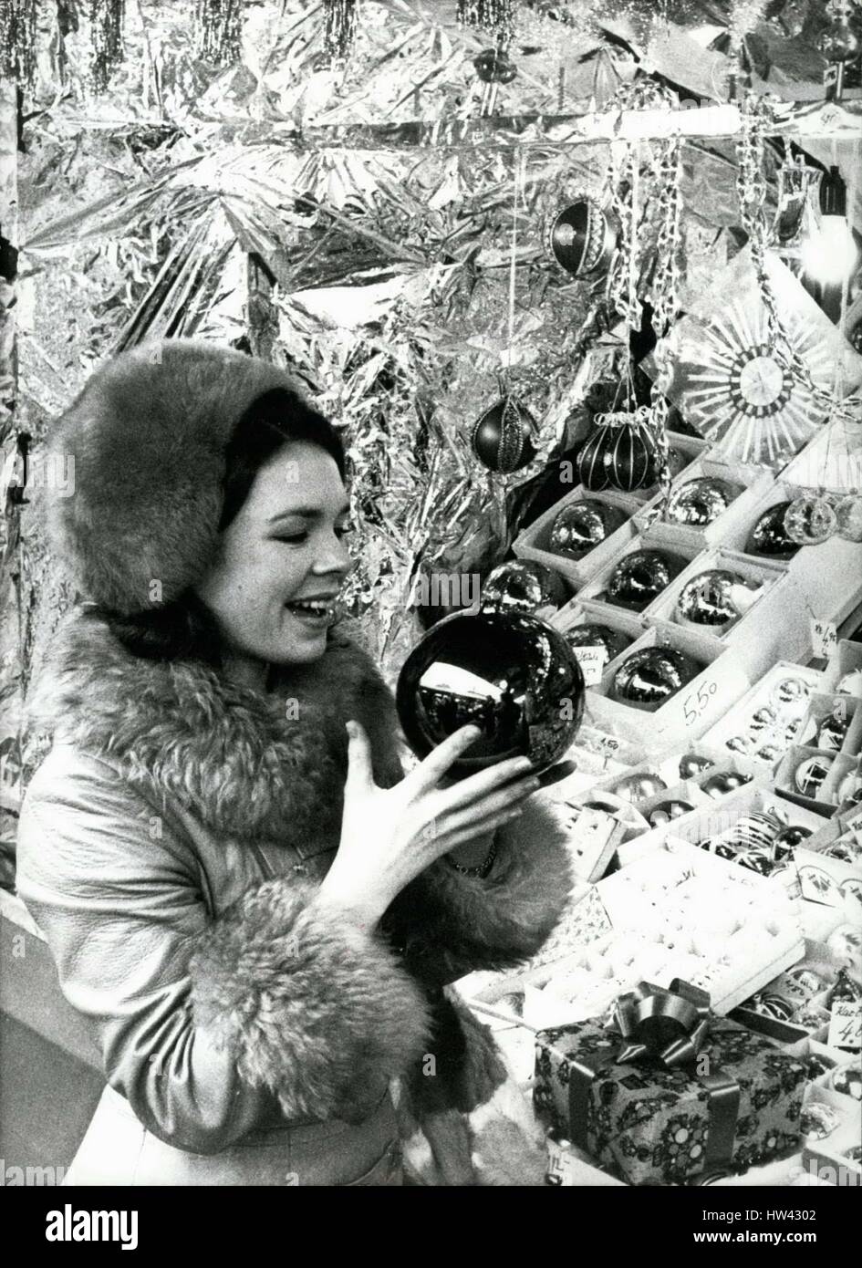 Dec. 15, 1970 - Irish Singer Dana at Munich's ''Christkindlmarkt''. Singer Dana enjoyed her 'shopping walk' at Munich's ''Christkindlmarkt'' like a child. the 20 year old Irish girl, with the song ''All kinds of everything'' winner of the Grand Prix song festival 1970 was not only surprised by all the little things but she also bought many things: many Christmas tree balls and other decorations for the huge Christmas tree in her home town Londonderry, gingerbread and almonds as taste for herself. Dana Brown, accompanied by her father, who is her manager, came to Munich in business matter. OPS: Stock Photo