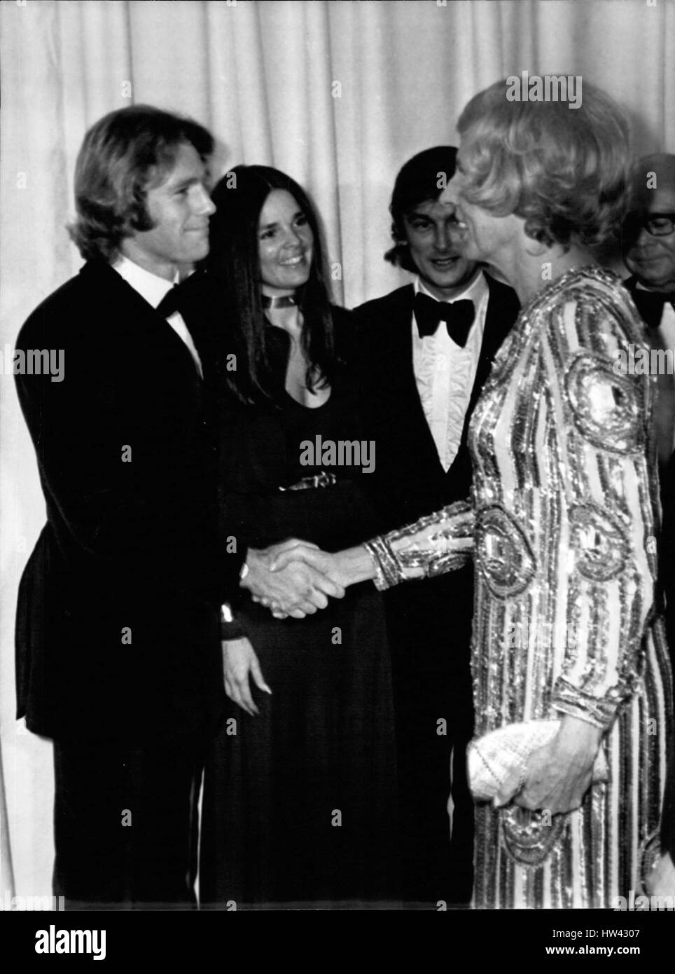 Mar. 03, 1971 - Mrs. Pompidou, the wife of the French President, went to the premier of ''Love Story, '' the latest big success in the US, at the Champs Elysees Theater. The gala was given to benefit cancer research. Mrs. Pompidou congratulates actors Ryan O'Neal and Ali Ma (Credit Image: © Keystone Press Agency/Keystone USA via ZUMAPRESS.com) Stock Photo