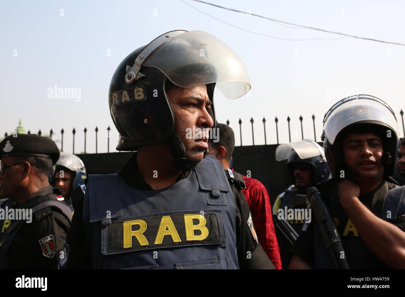 Dhaka, Bangladesh. 17th Mar, 2017. Bangladesh security personnel gather around a cordoned off area at a military camp after an attempted suicide bomb attack in Dhaka, Bangladesh on March 17, 2017. A man blew himself up at a camp for Bangladesh's elite security forces, wounding two others, in an apparent botched suicide attack. The incident came a day after a series of raids on suspected militant hideouts in the troubled country, which has suffered a series of Islamist attacks in recent years. Credit: zakir hossain chowdhury zakir/Alamy Live News Stock Photo