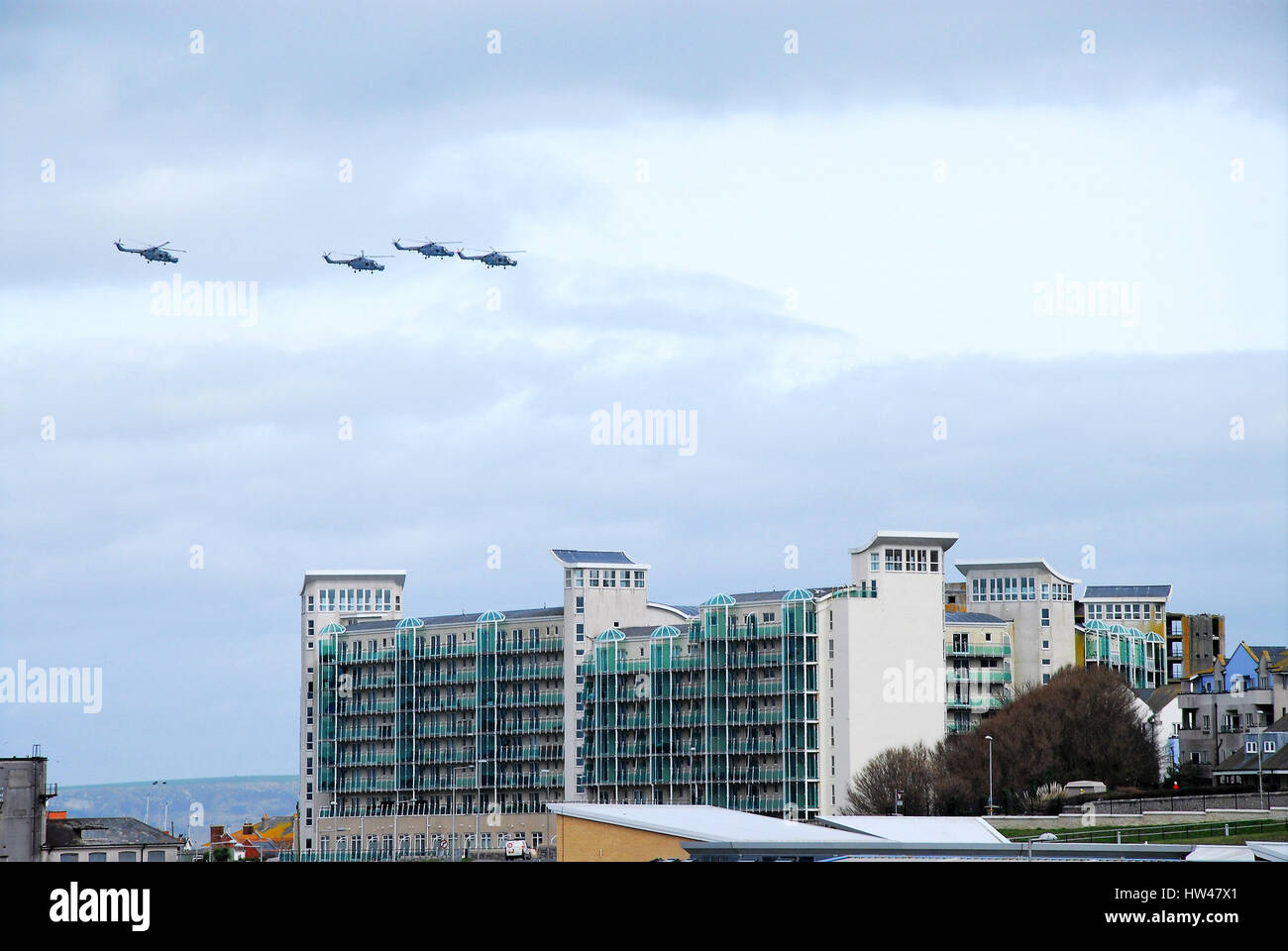 Portland, UK. 17th Mar, 2017. Four Lynx Mk 8 helicopters take part in a fly-past over former HMS Osprey, Portland, before being decommissioned after 41 years. Pilots, including Prince Andrew, were trained here. In the Prince's case, his piloting skills saw service in the Falklands Conflict of 1982 Credit: stuart fretwell/Alamy Live News Stock Photo