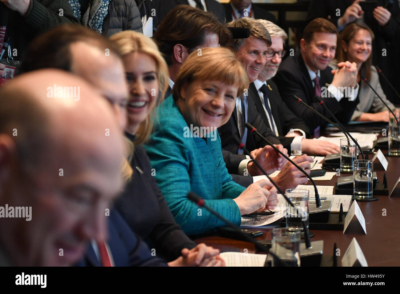 German Chancellor Angela Merkel (C), with Ivanka Trump (left center), smiles during a roundtable discussion on vocational training with United States and German business leaders, lead by President Donald Trump (not seen), in the Cabinet Room of the White House in Washington, DC on March 17, 2017. Credit: Photo by Pat Benic/Pool via CNP /MediaPunch Stock Photo