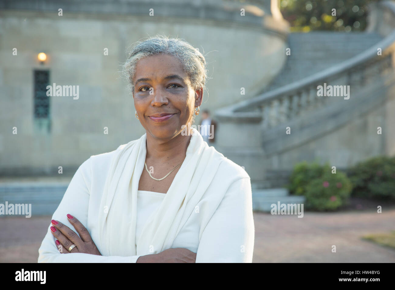 Portrait of Black woman posing near stone staircase Stock Photo