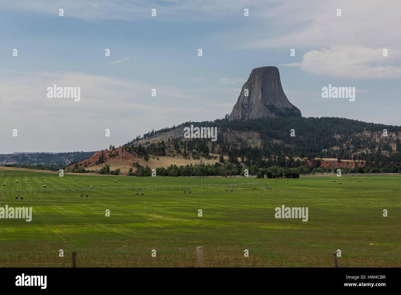 Devils Tower rock and farm fields in remote landscape, Wyoming, United States Stock Photo
