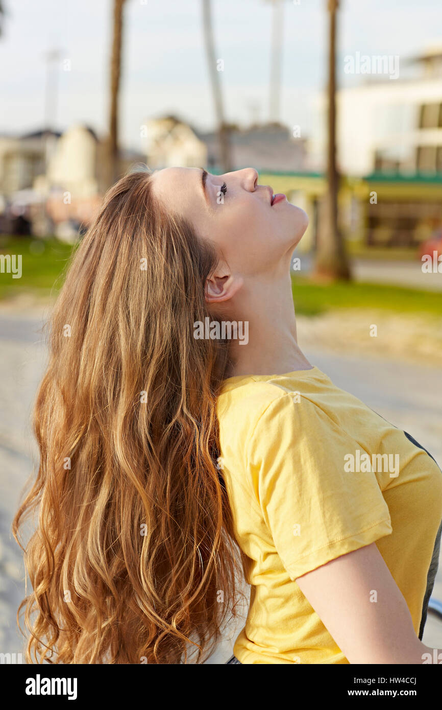 Caucasian woman tossing her hair Stock Photo