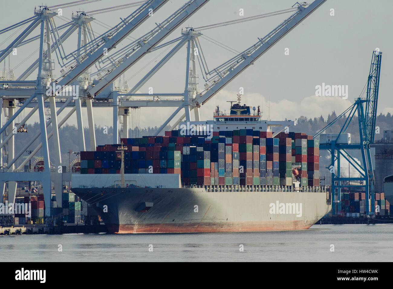 Cargo containers on freighter at shipping port Stock Photo