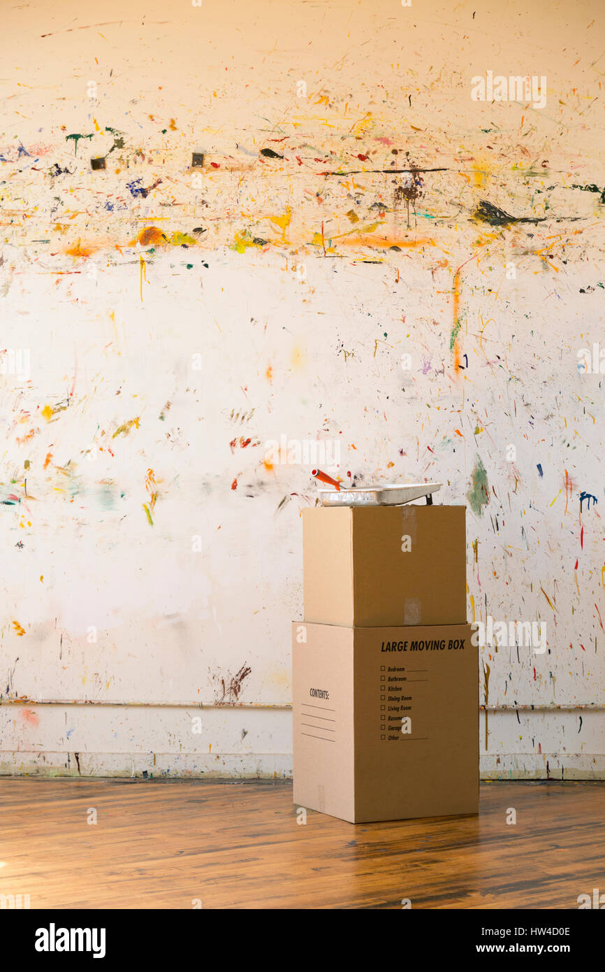 Paint splattered on wall near cardboard boxes Stock Photo Alamy