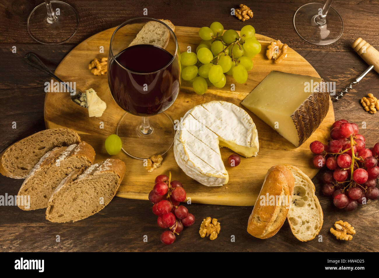 Wine and cheese tasting with bread and grapes Stock Photo