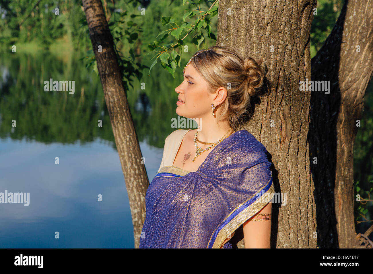 Beautiful European Woman In Traditional Indian Sari Near The Lake Stock Photo Alamy