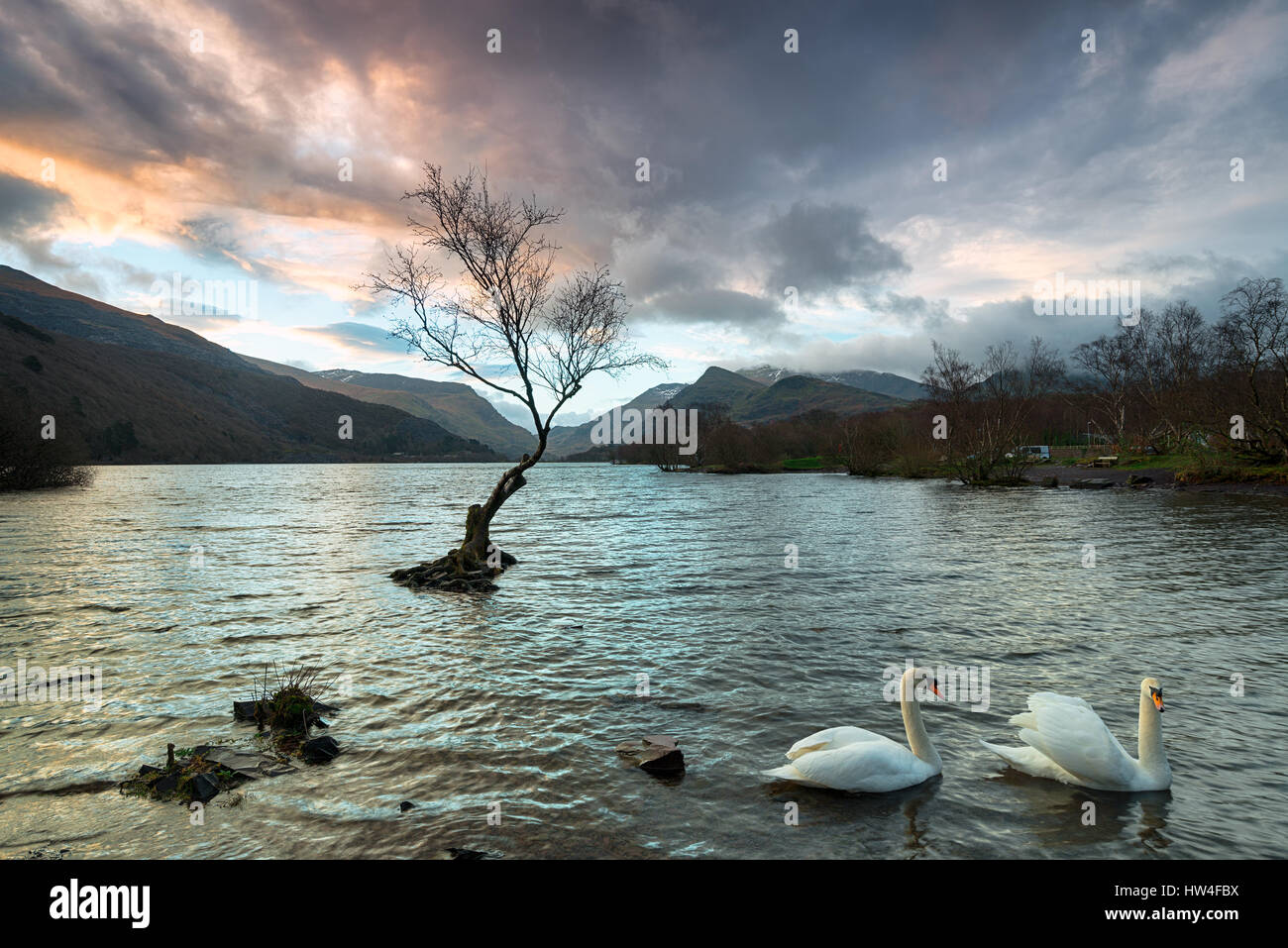 Stormy sunrise over Llyn Padarn lake in Snowdonia National Park in Wales Stock Photo