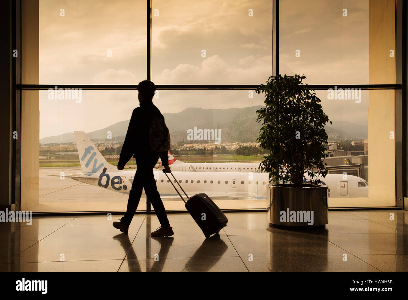 Tourist with luggage at Malaga airport. Costa del Sol, Malaga. Andalusia southern Spain. Europe Stock Photo