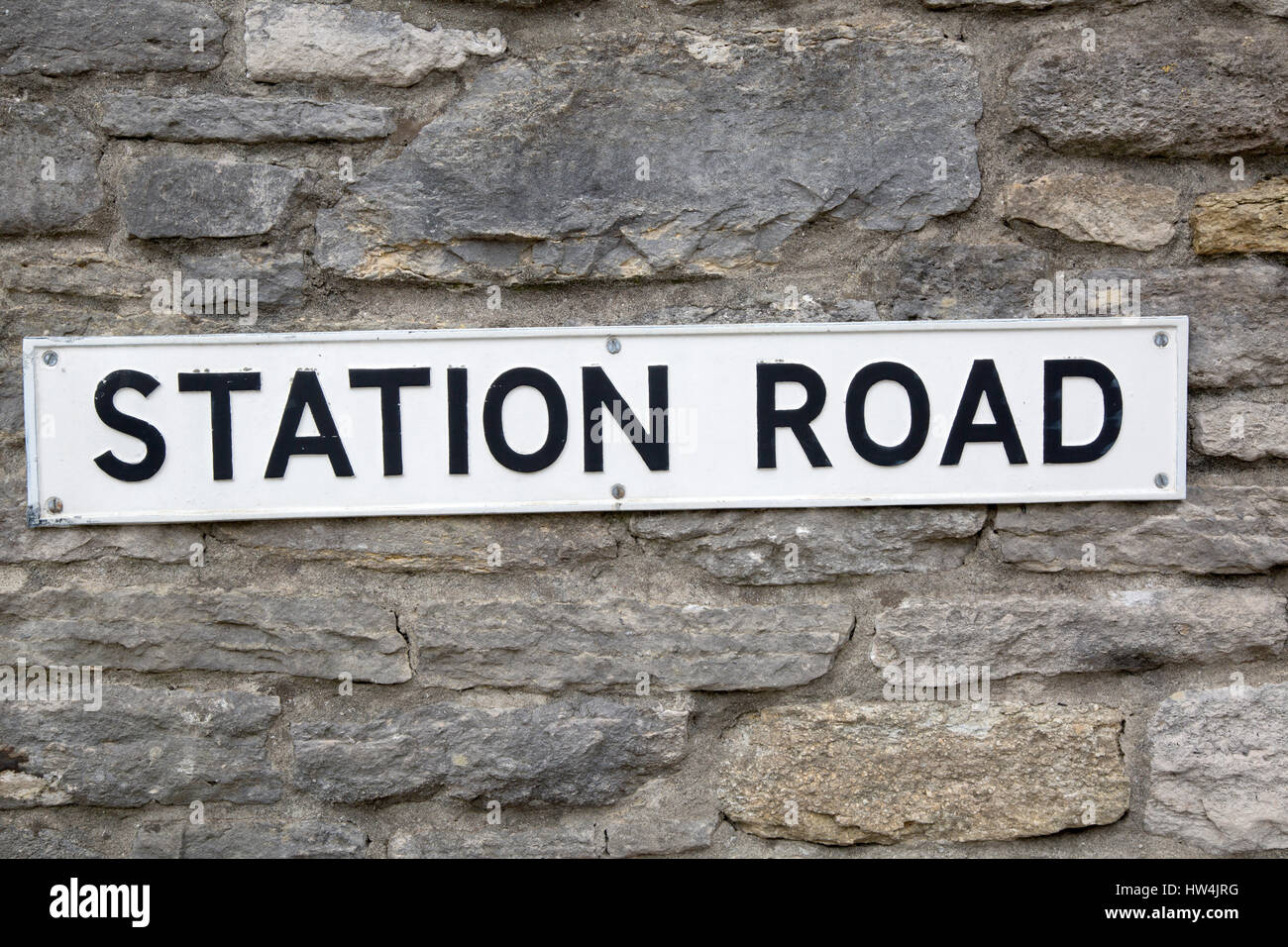 Station Road Sign on Stone Wall Stock Photo Alamy