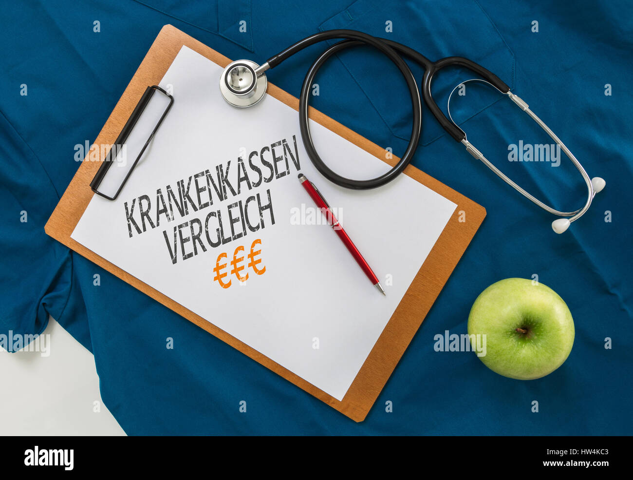 Krankenkassen Vergleich (in german Health insurance comparison) Clipboard with stethoscope. Stock Photo
