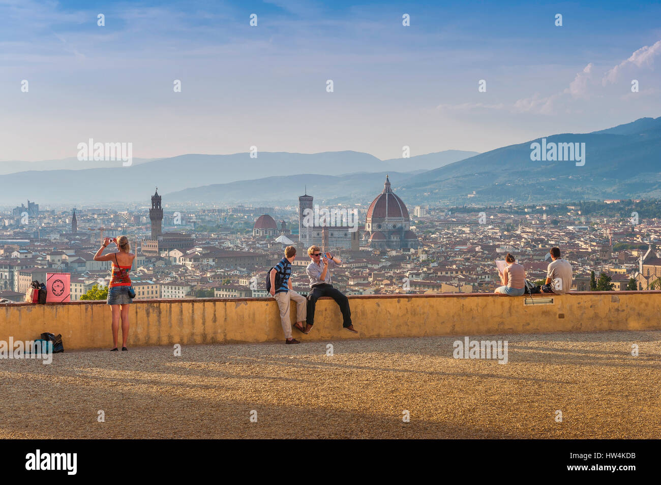 Florence cityscape, visitors to Florence gather at sunset on the terrace at San Miniato al Monte overlooking the renaissance city center,Tuscany Italy Stock Photo