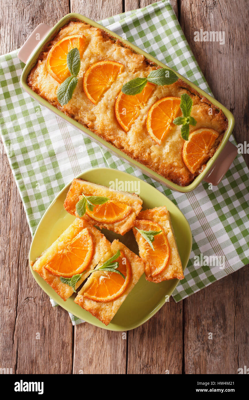 Greek Orange filo pie portokalopita close-up in a baking dish. Vertical view from above Stock Photo