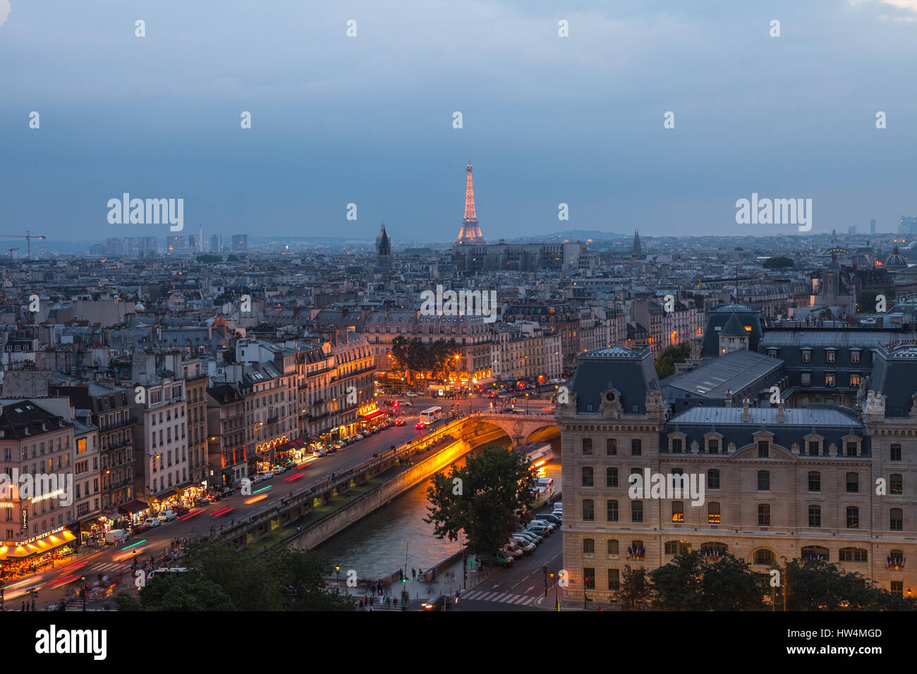 PARIS - JULY 15, 2014 : Eiffel Tower and Seine river in the night time on July 15,2014 in Paris. Night view from the rooftop of Notre Dame Cathedral i Stock Photo