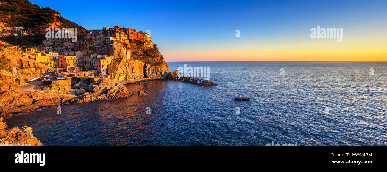 Manarola village on cliff rocks and sea at sunset., Seascape in Five lands, Cinque Terre National Park, Liguria Italy Europe. Panoramic view. Stock Photo
