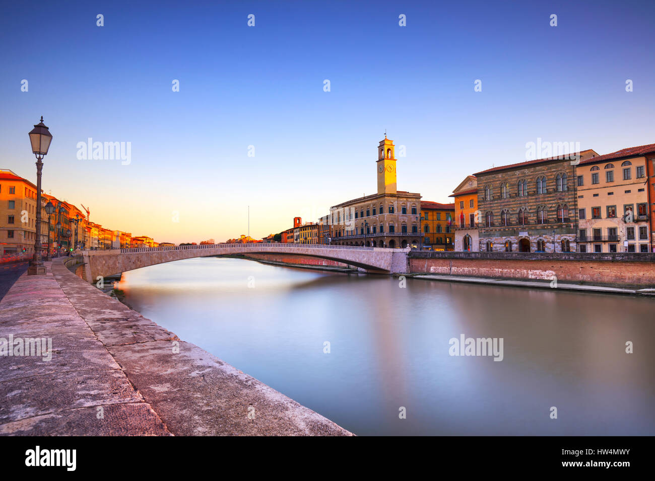 Pisa, Arno river, Ponte di Mezzo bridge and street lamp. Lungarno view. Long Exposure. Tuscany, Italy, Europe. Stock Photo