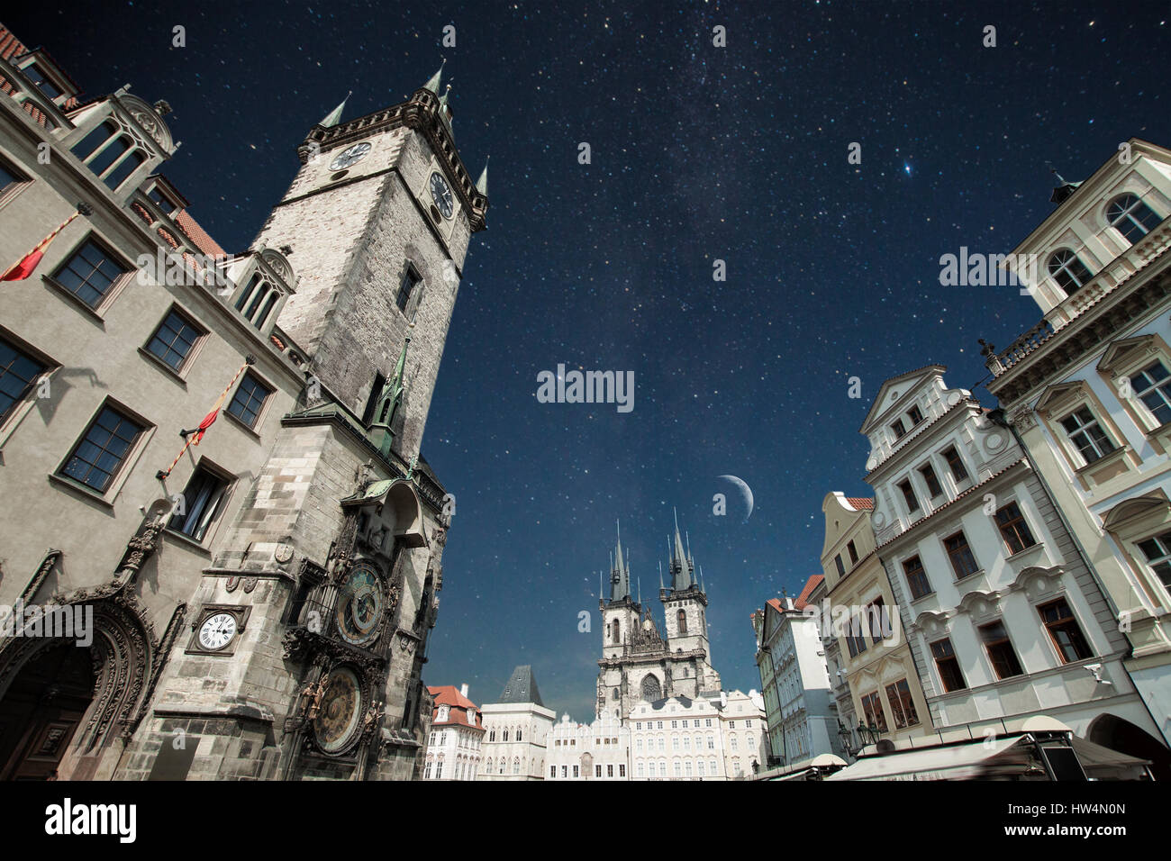 Prague Old town square, Tyn Cathedral. under sunlight. At night the stars shine and the moon. Stock Photo