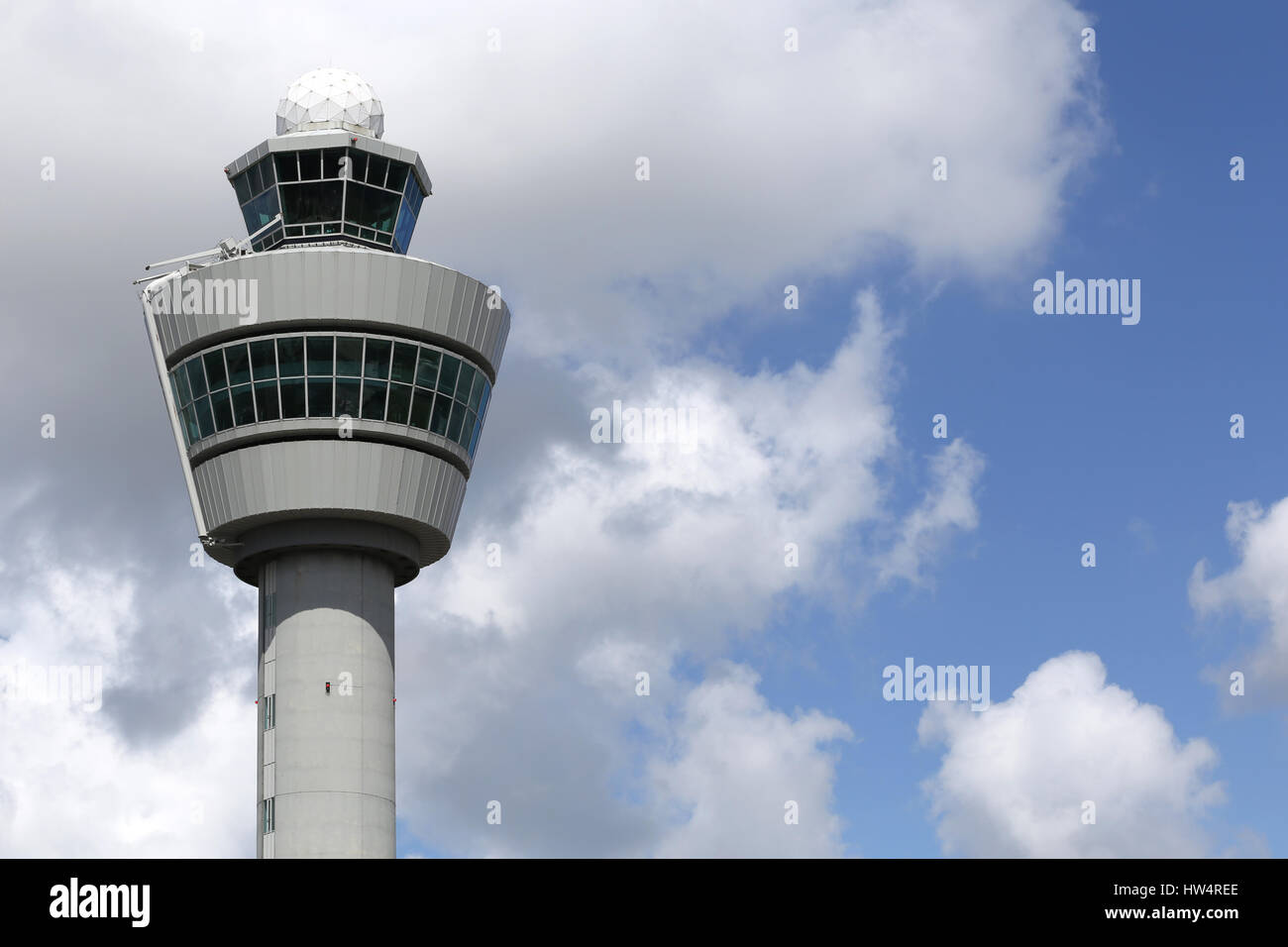 Air traffic control tower of Amsterdam Airport Schiphol. With a height of 101 m (331 ft), was the tallest in the world when constructed in 1991. Stock Photo