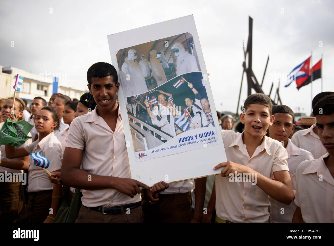 Cuban school children carrying revolutionary placards during the May