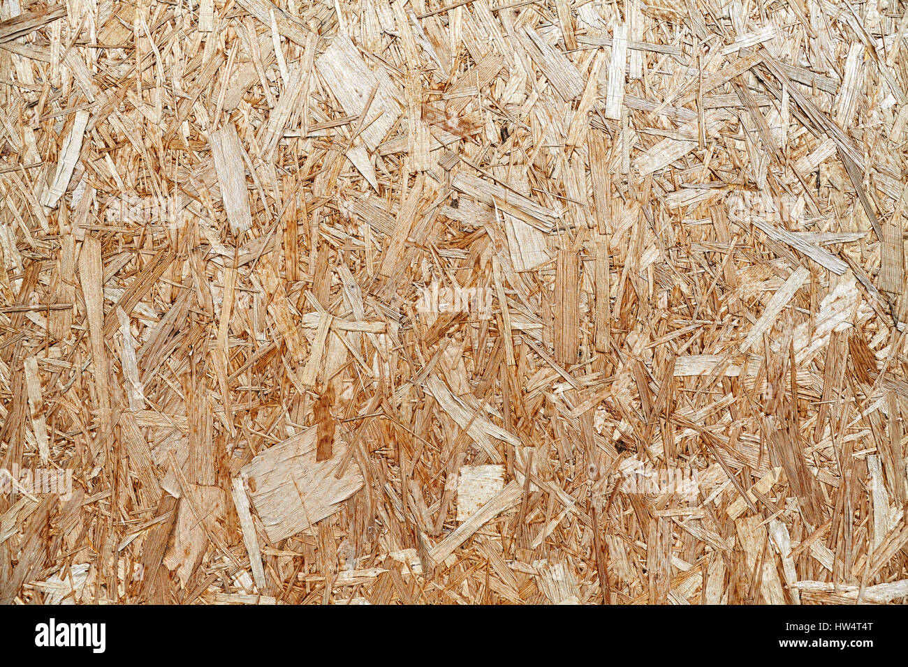 An old oriented strand board (OSB), fiberboard background of texture. Stock Photo